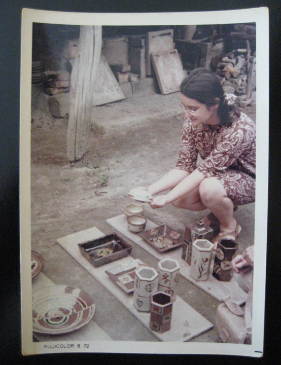 This bowl is pictured on the far right of the ware board closest to the woman in the picture, the original owner of the bowl. She initially couldn't decide between the bowl she was holding in her hands (a summer tea bowl) and the bowl here. In the end, she chose the bowl that is currently offered.
