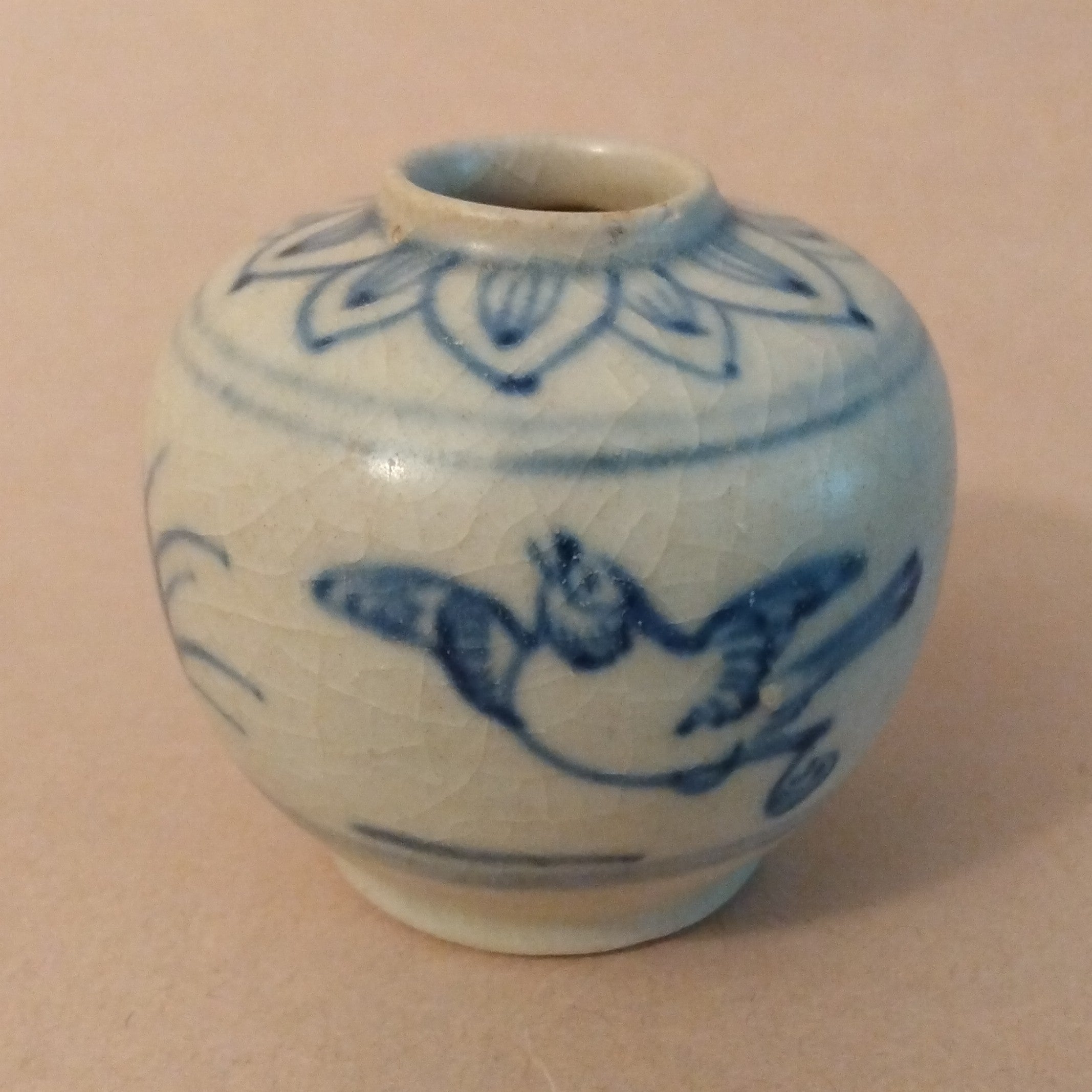 Ceramic Jarlet with underglaze cobalt blue decoration of birds and grasses on the body and lotus petals around the shoulders. Vietnam, ca. 15-17th C