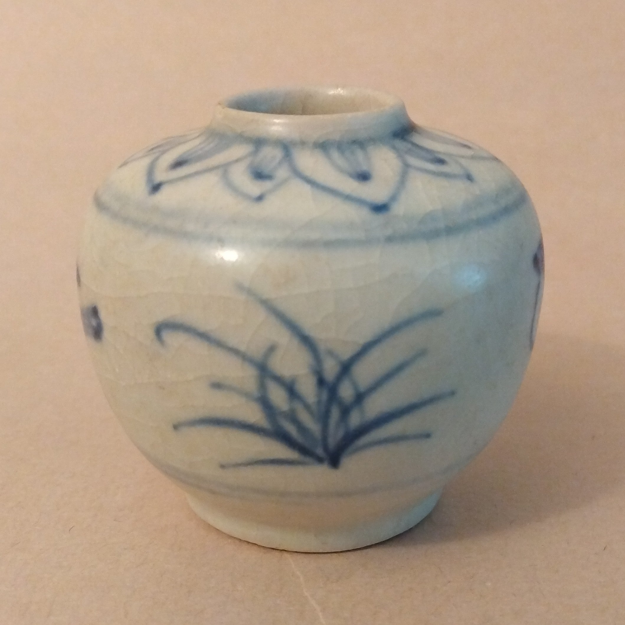 Ceramic Jarlet with underglaze cobalt blue decoration of birds and grasses on the body and lotus petals around the shoulders. Vietnam, ca. 15-17th C