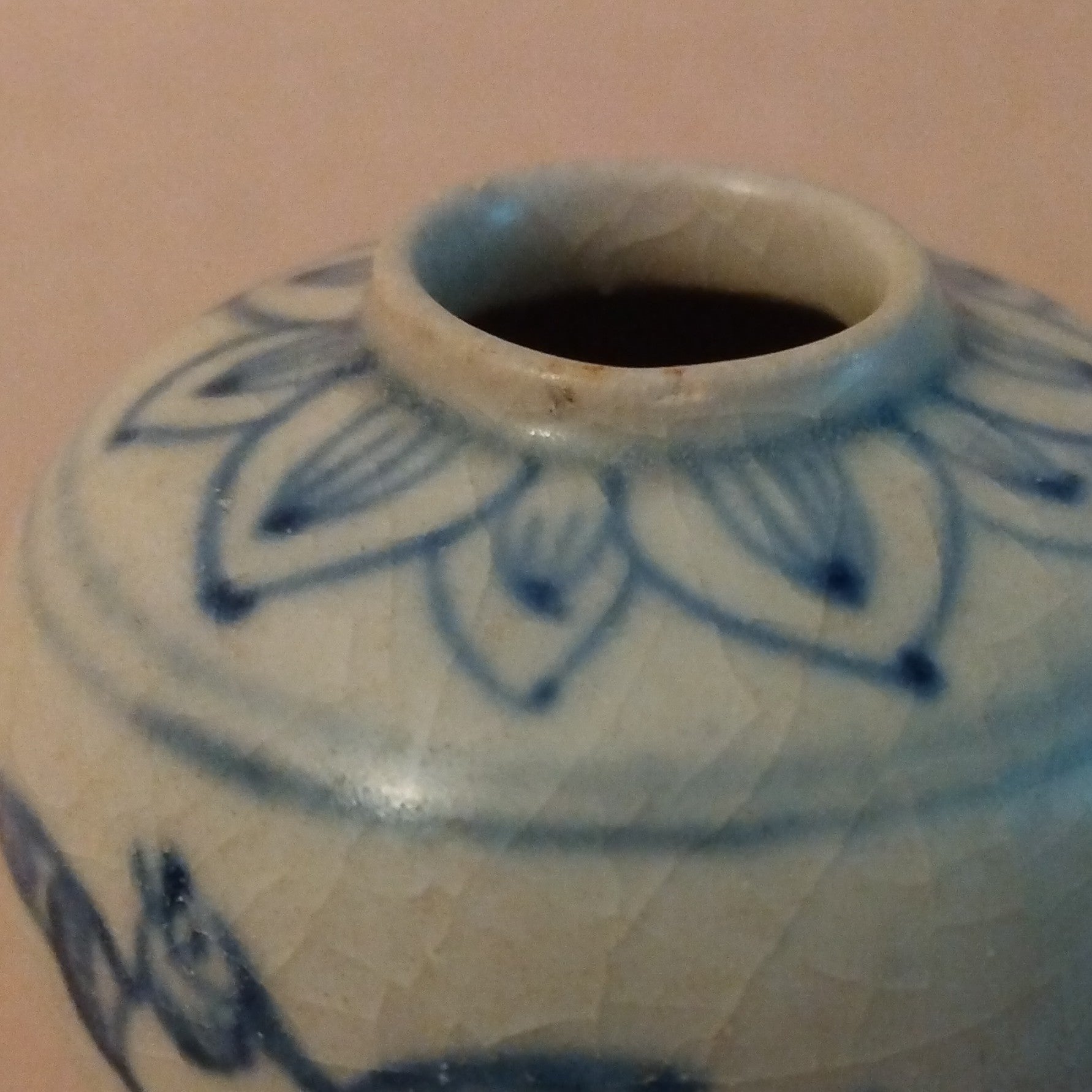 Ceramic Jarlet with underglaze cobalt blue decoration of birds and grasses on the body and lotus petals around the shoulders. Vietnam, ca. 15-17th C