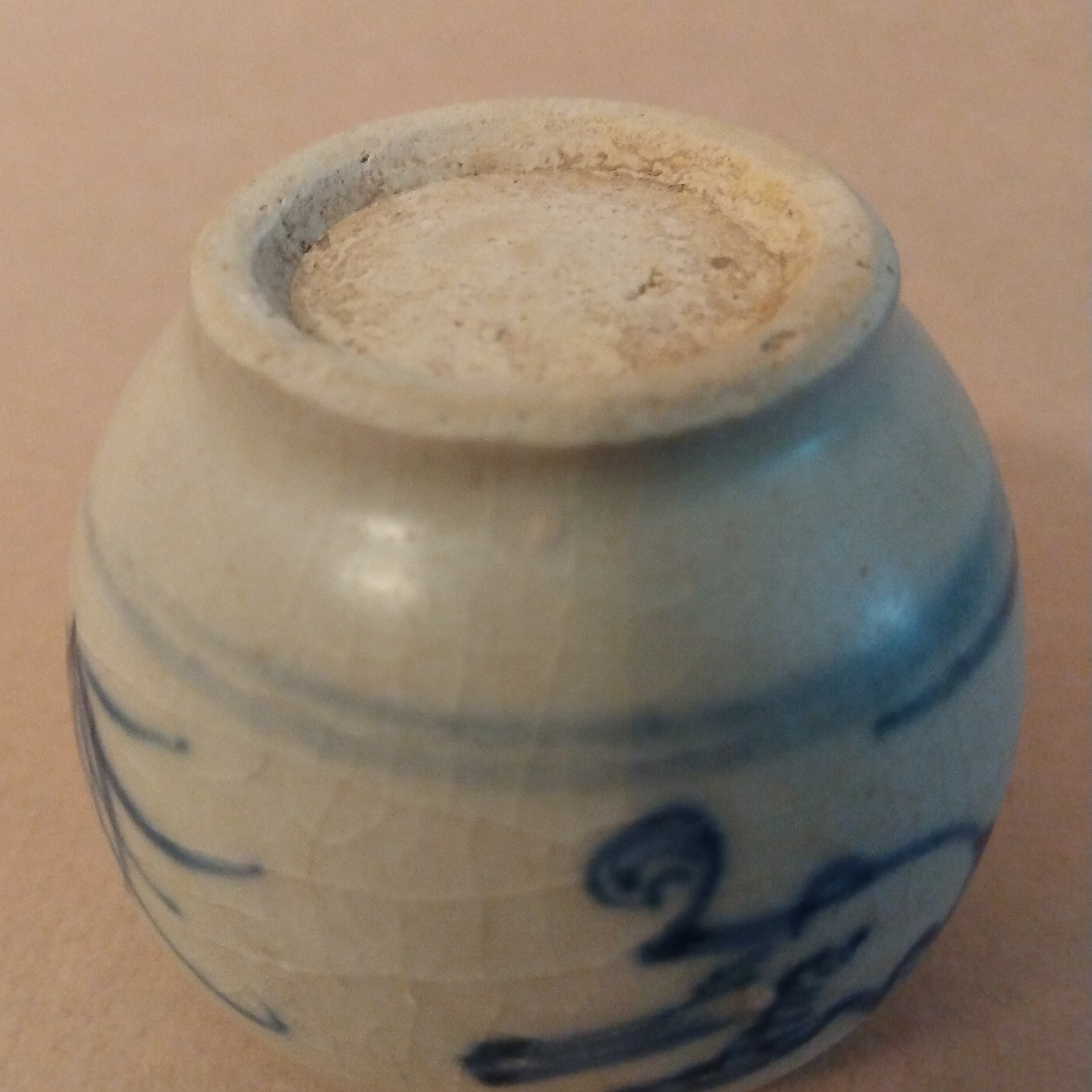 Ceramic Jarlet with underglaze cobalt blue decoration of birds and grasses on the body and lotus petals around the shoulders. Vietnam, ca. 15-17th C