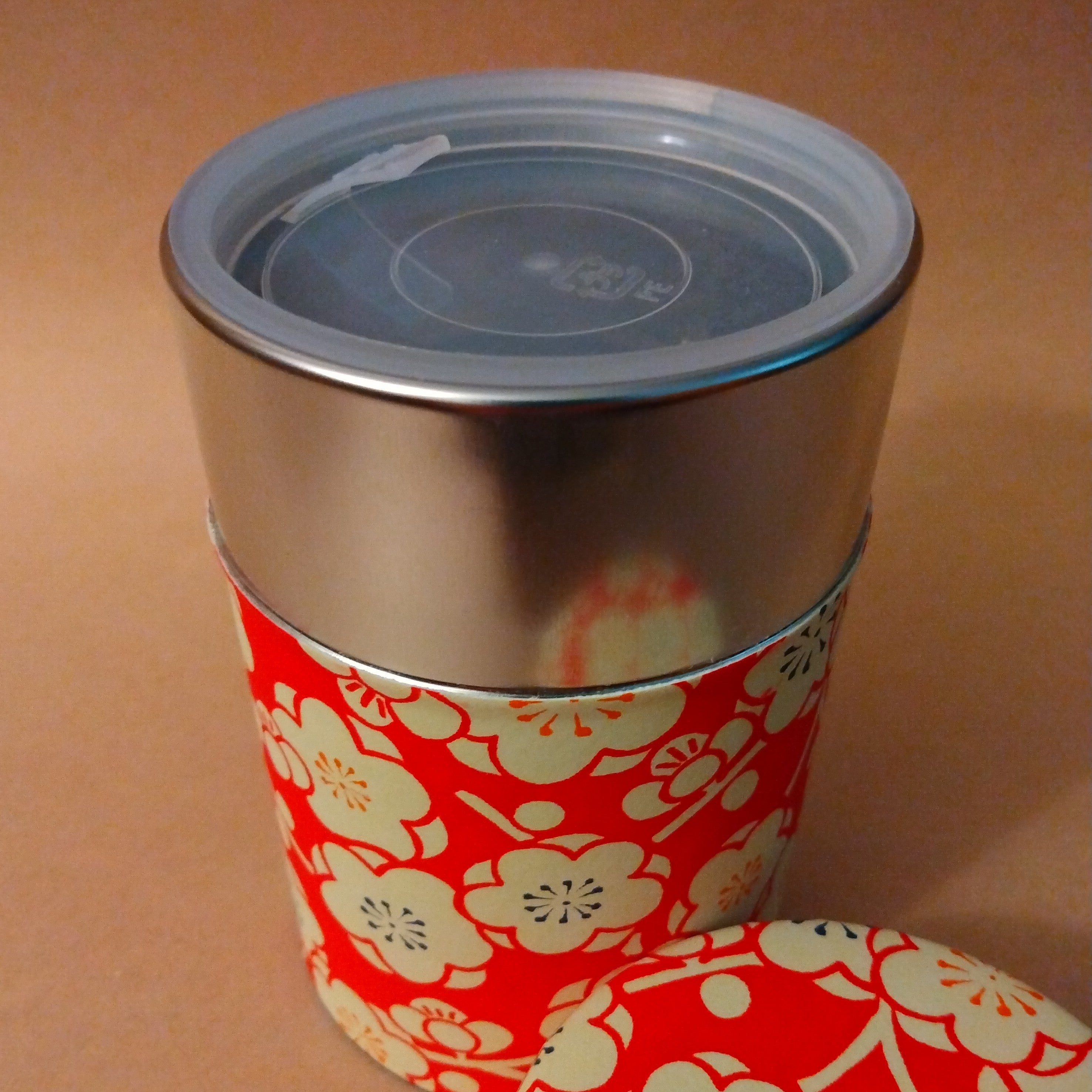 Chazutsu, Tea Canister, holds 150 grams, Stainless Steel covered in Red Washi Paper with Plum Blossom Motif