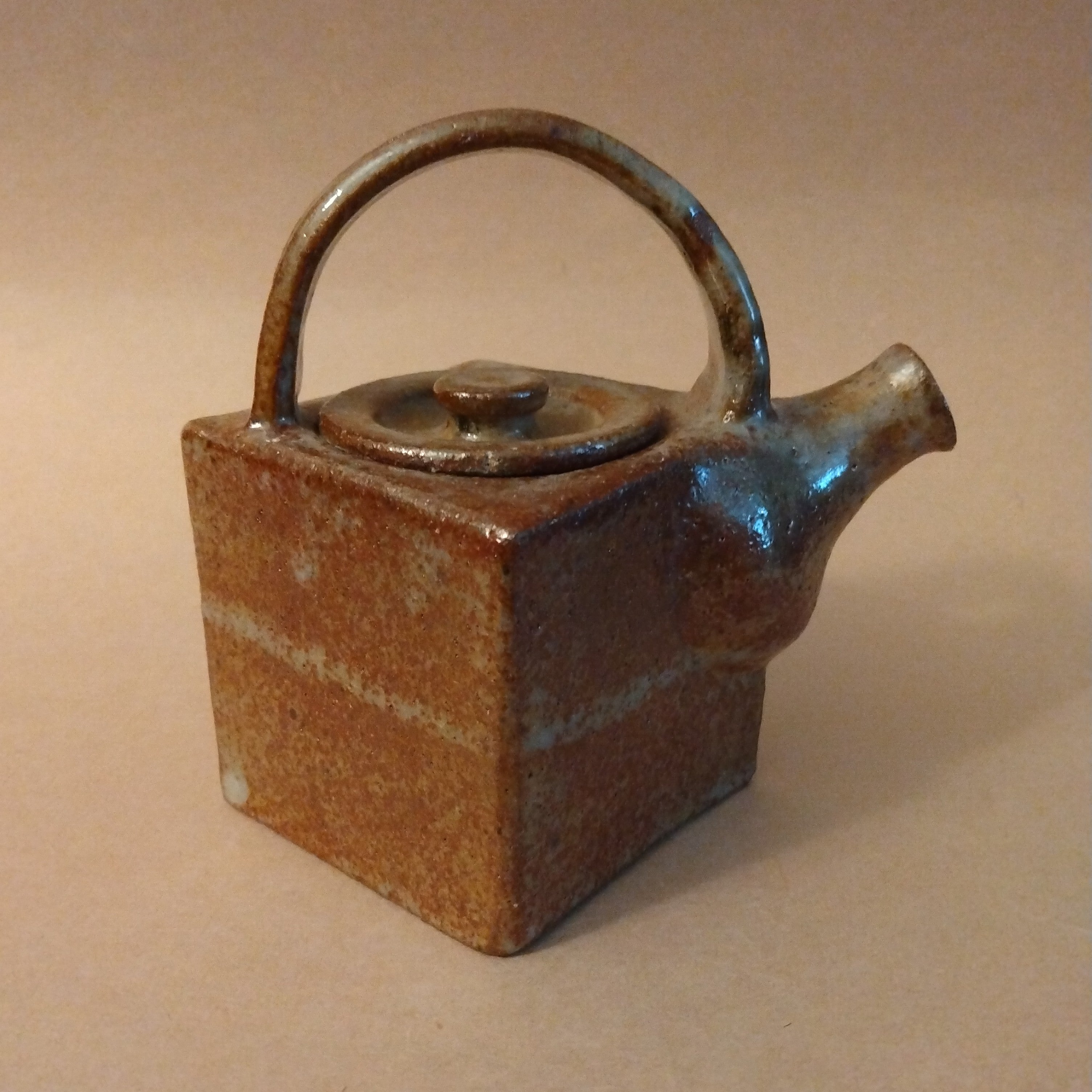 Diamond-shaped Tea Pot with Overhead Handle, by George Gledhill